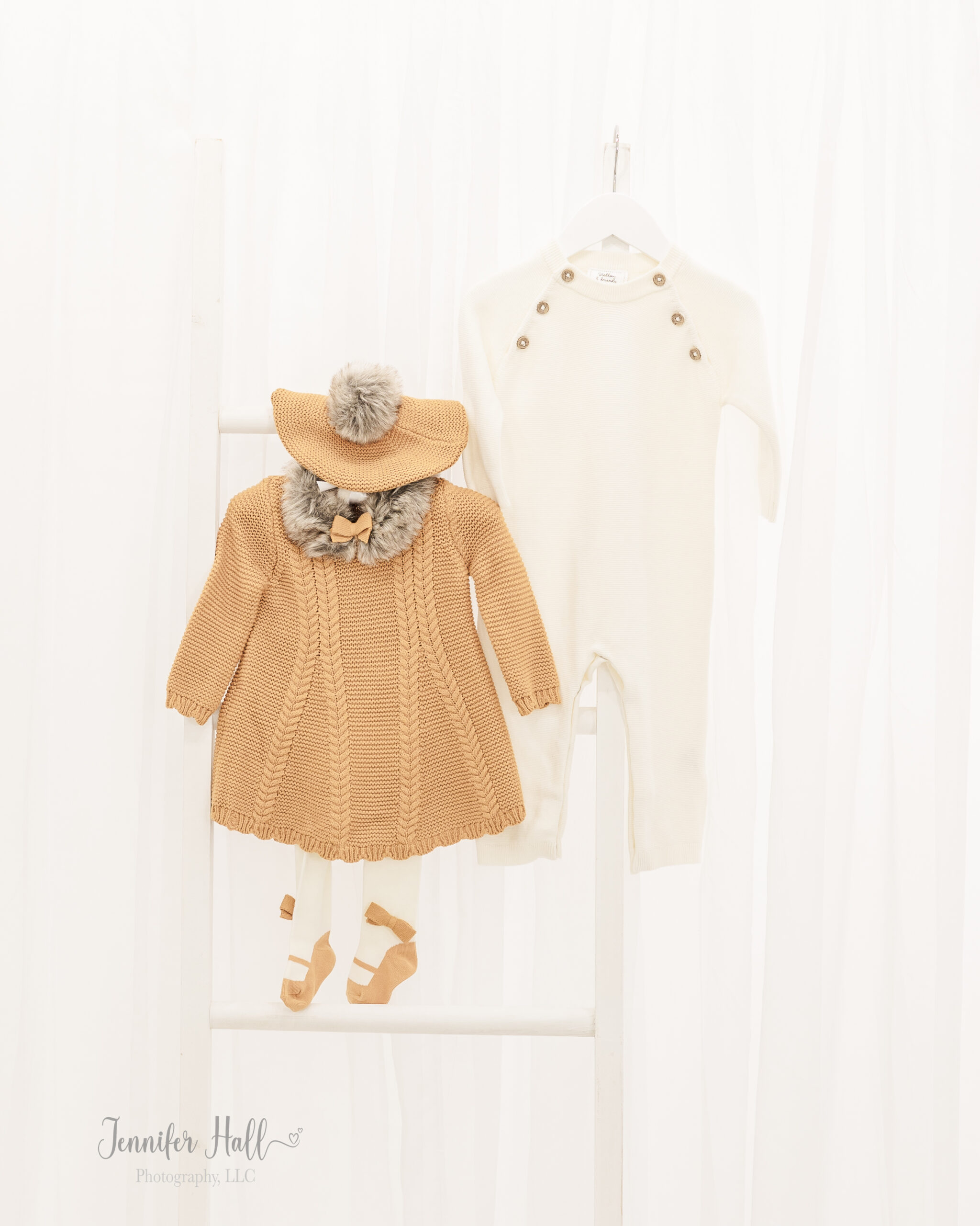 Small mustard sweater dress, cream leggings, and a mustard beret for a little girl, and a cream onesie with tan buttons for a little boy for fall family outfits.