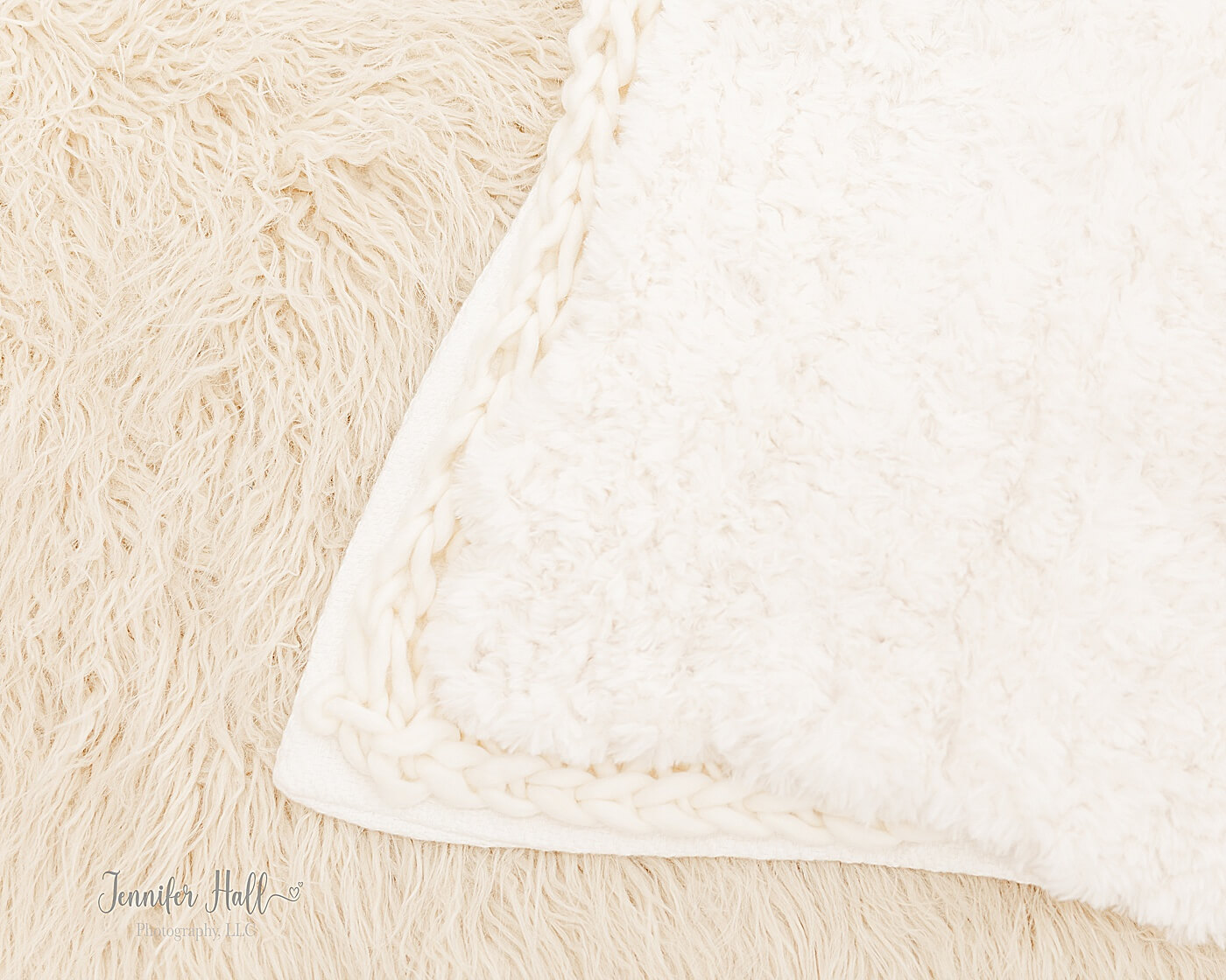 French gold, cream, and white blankets with different textures laying on one another for family portrait session accessories.