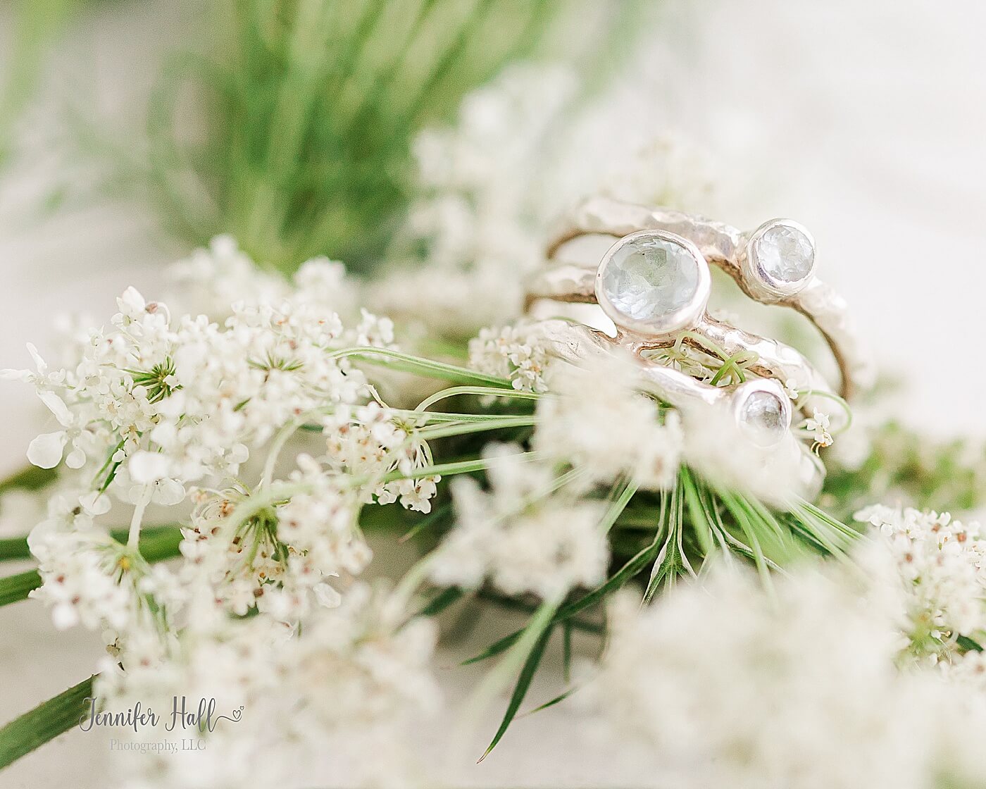 Ring laying on Queen Anne's Lace to show an accessory for girls' portrait session outfits.