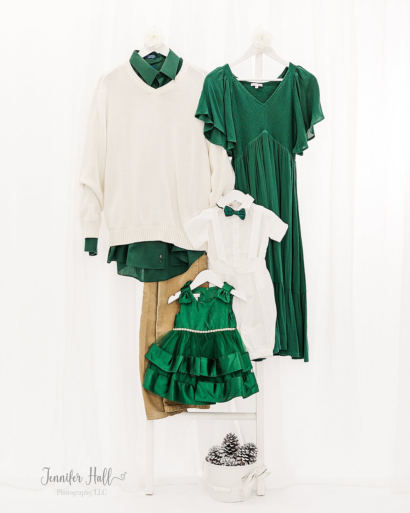 An evergreen dress, cream sweater, white collared shirt, and emerald dress for what to wear for Christmas family photos.