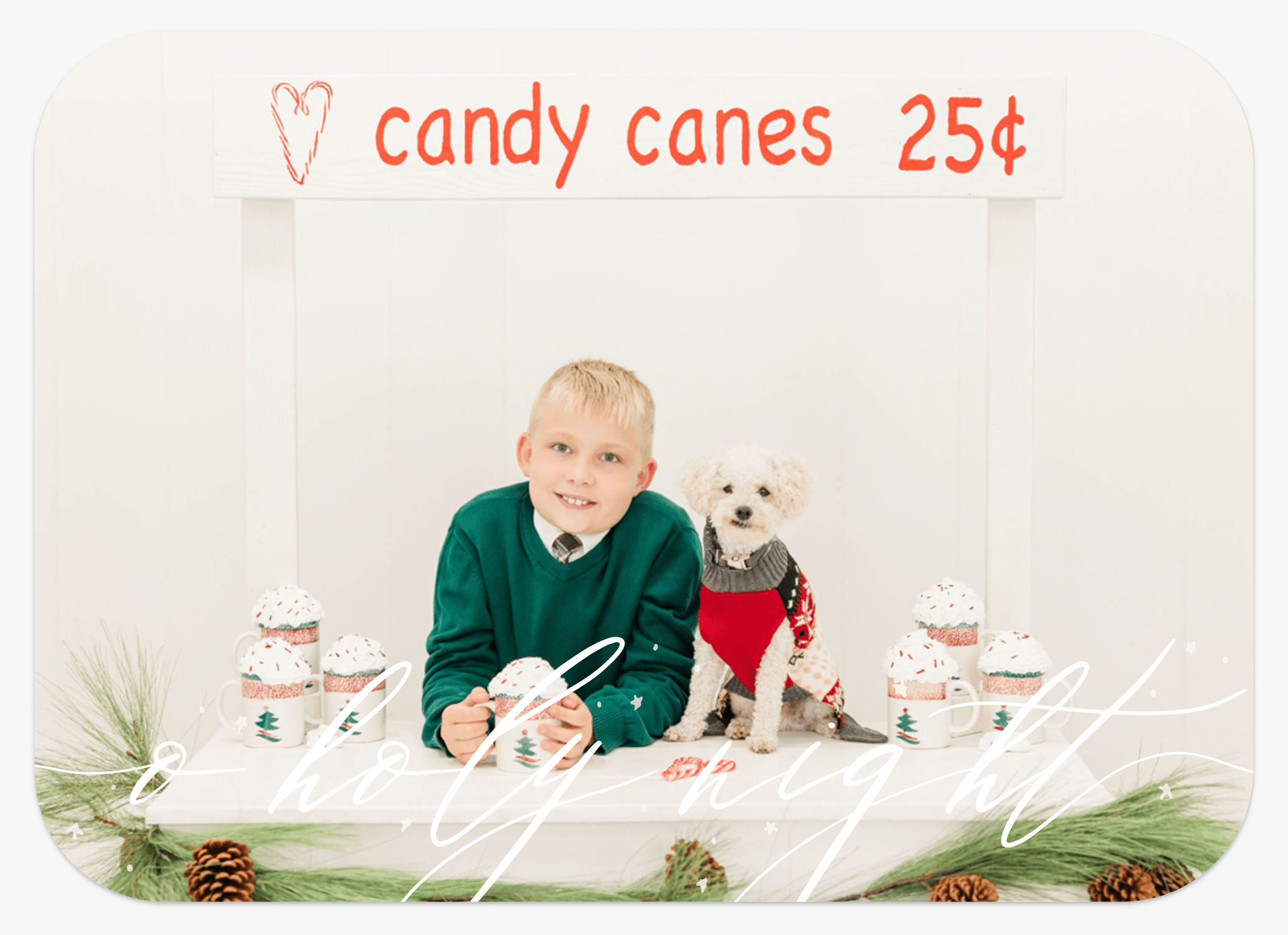 Screenshot of a family photo Christmas card with the words "o holy night" and a picture of a boy with hot cocoa mugs.