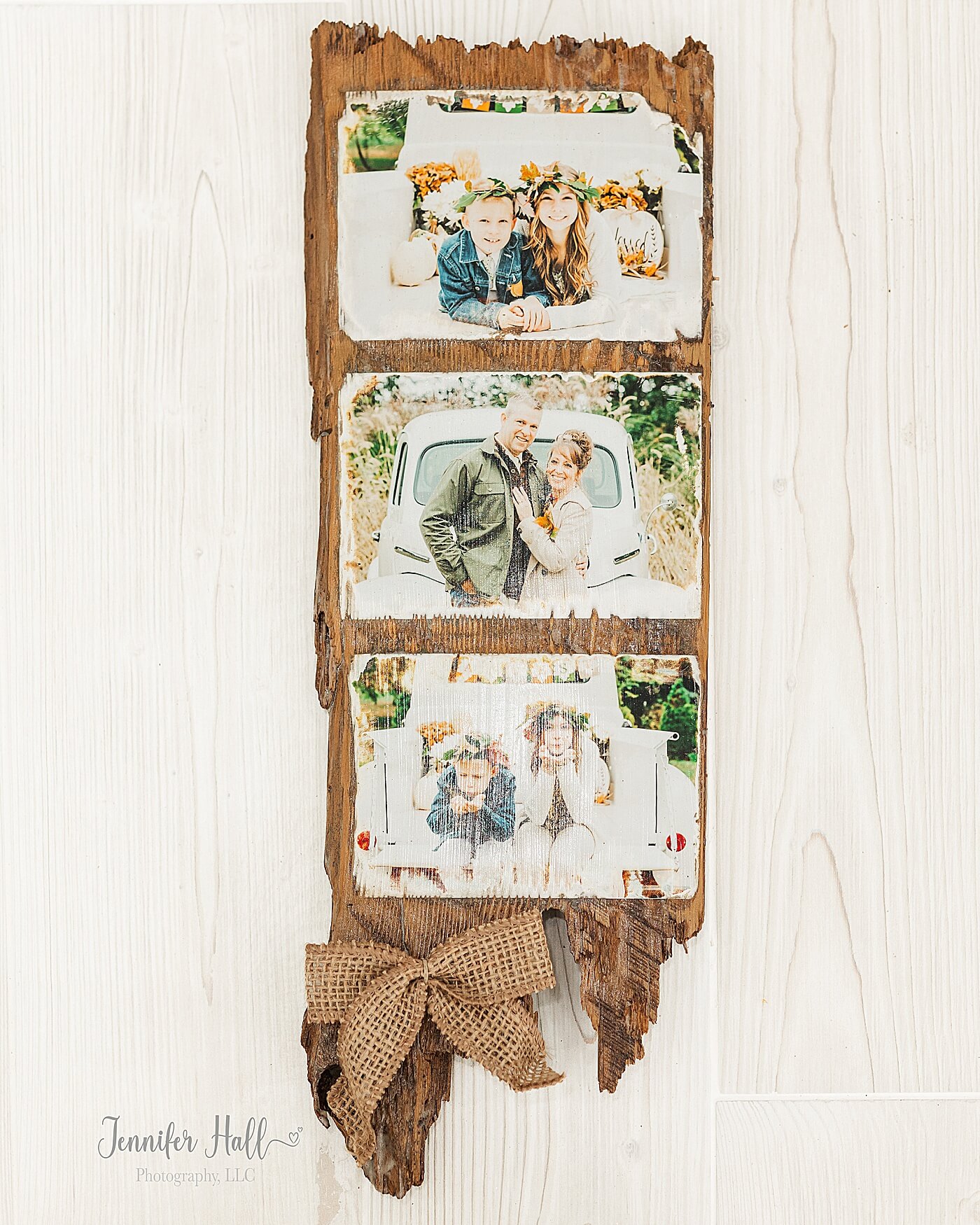 Wooden photo board with a burlap bow for a family photo gift idea for Christmas.