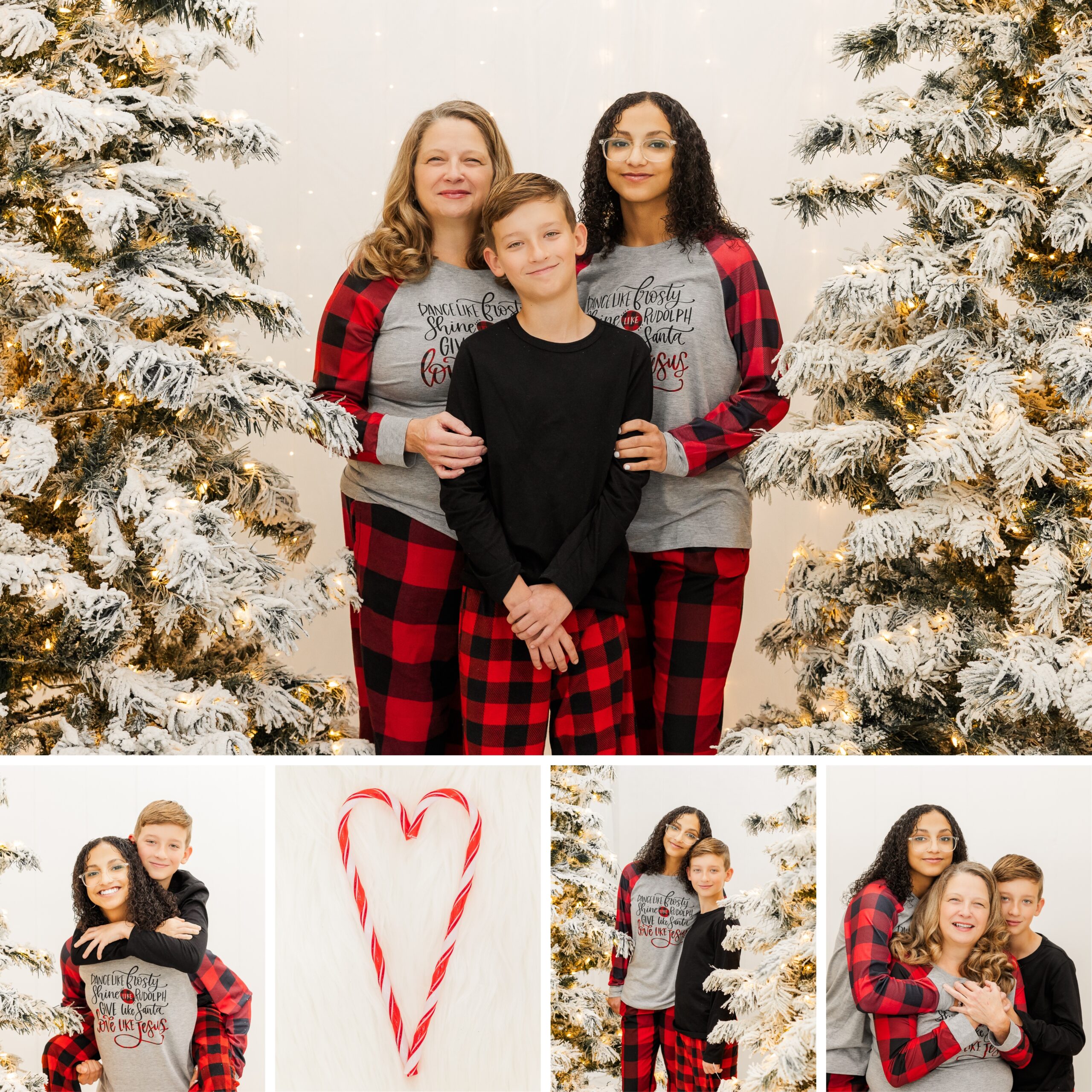 Family standing by snowy Christmas trees for Christmas family photos in-studio.