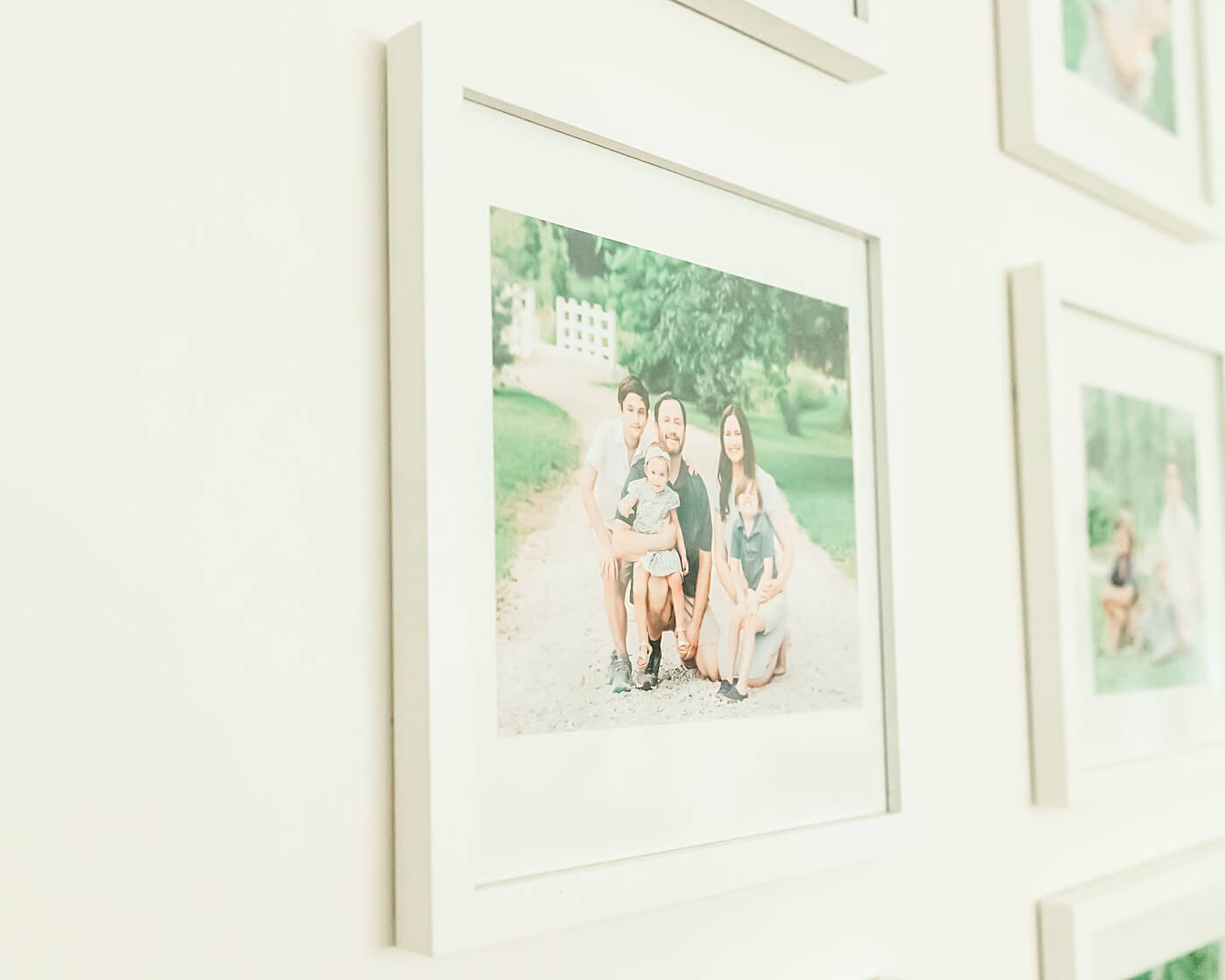 Framed family photo on a wall in a home.