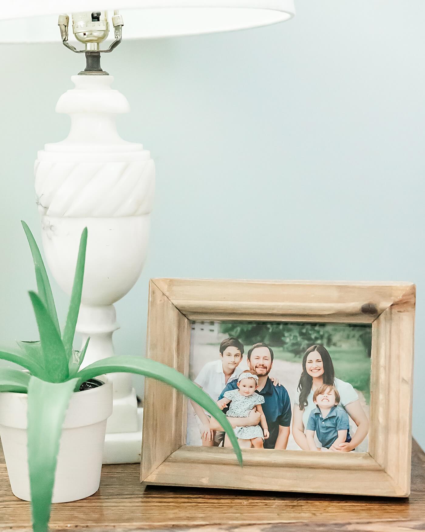 Joyful, Timeless family photo sitting on a stand.