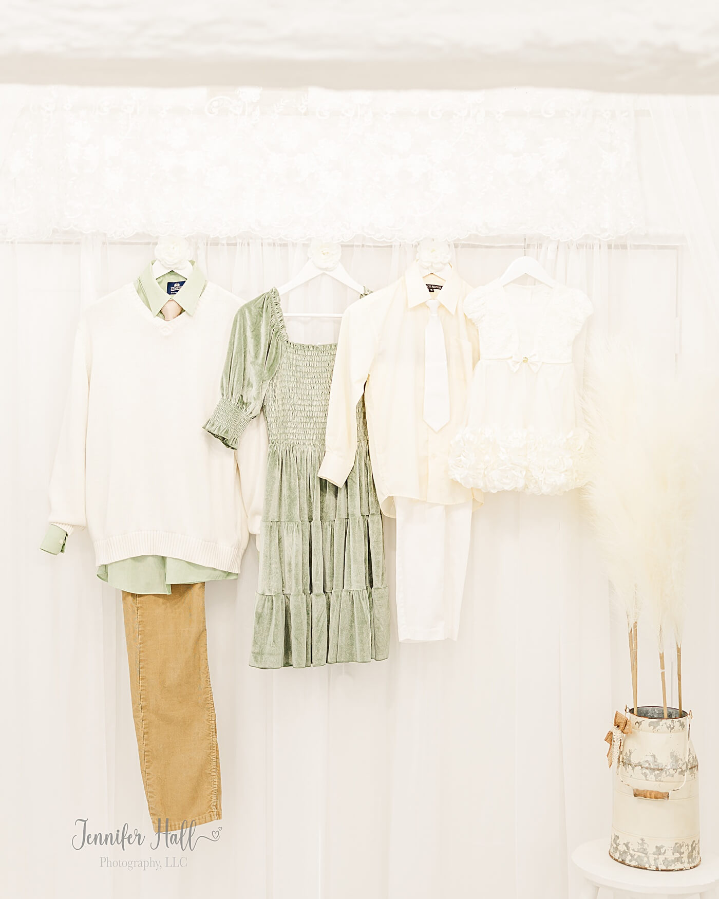 Sage, white, and tan family outfits displaying a fall color palette.