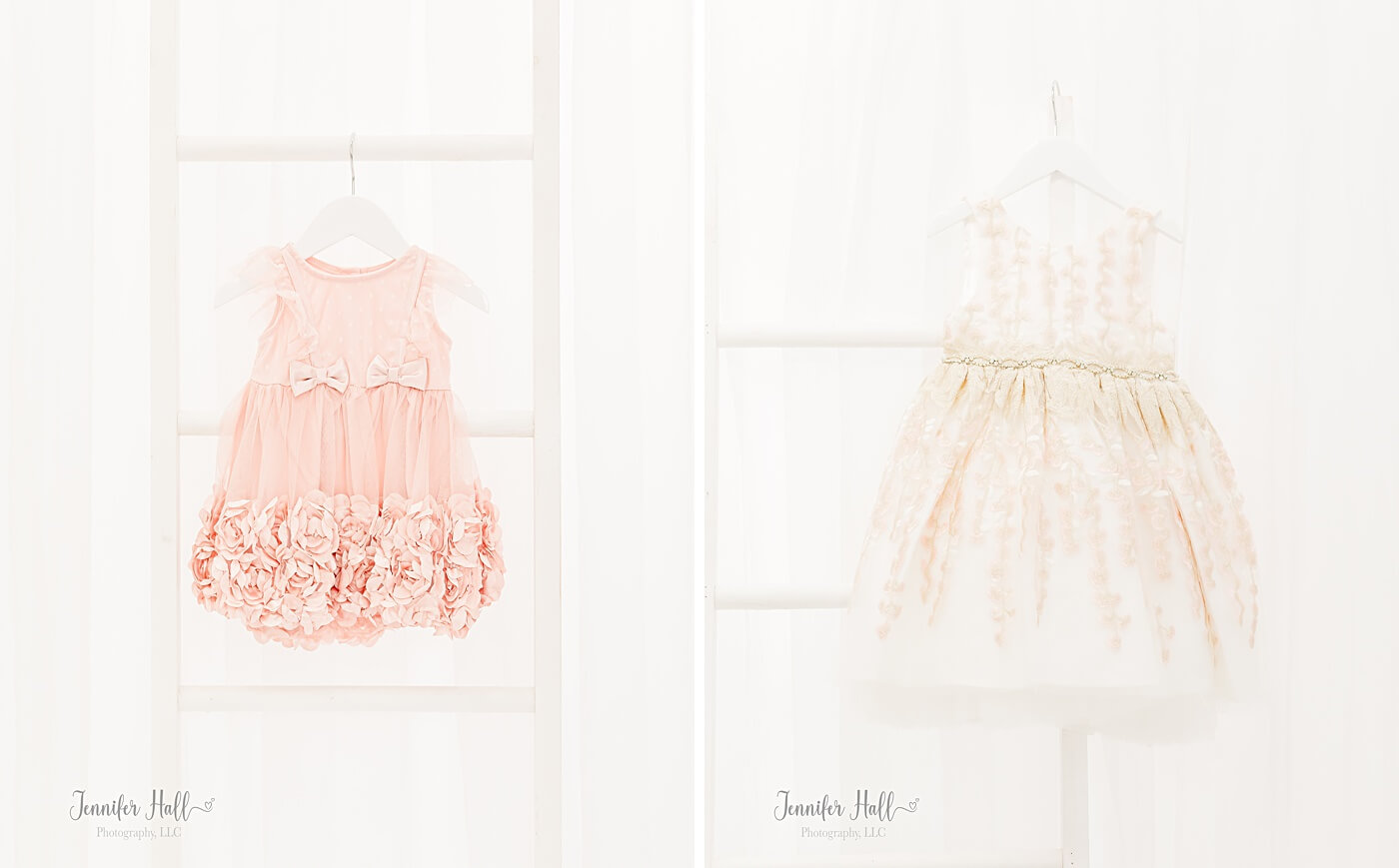 Blush dress hanging up, and a white dress with a design on a white hanger.