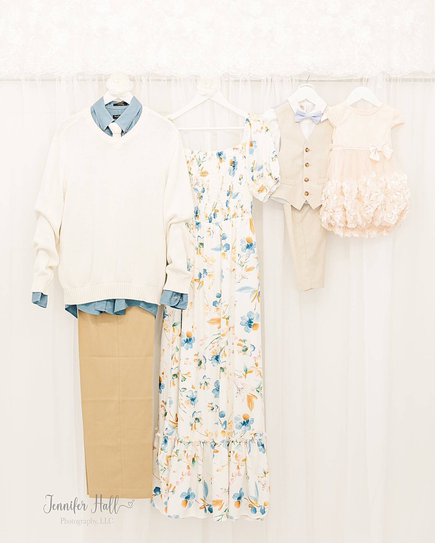 Dresses and shirts hanging up to show how to coordinate a family’s outfits for pictures.