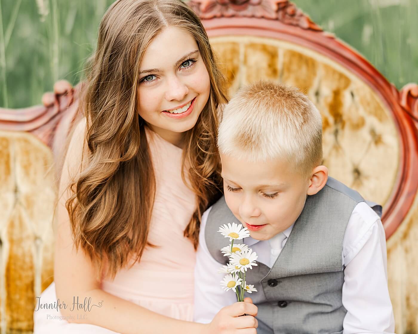 Kids with pink and gray dress clothes to show family picture outfit ideas for styling kids.