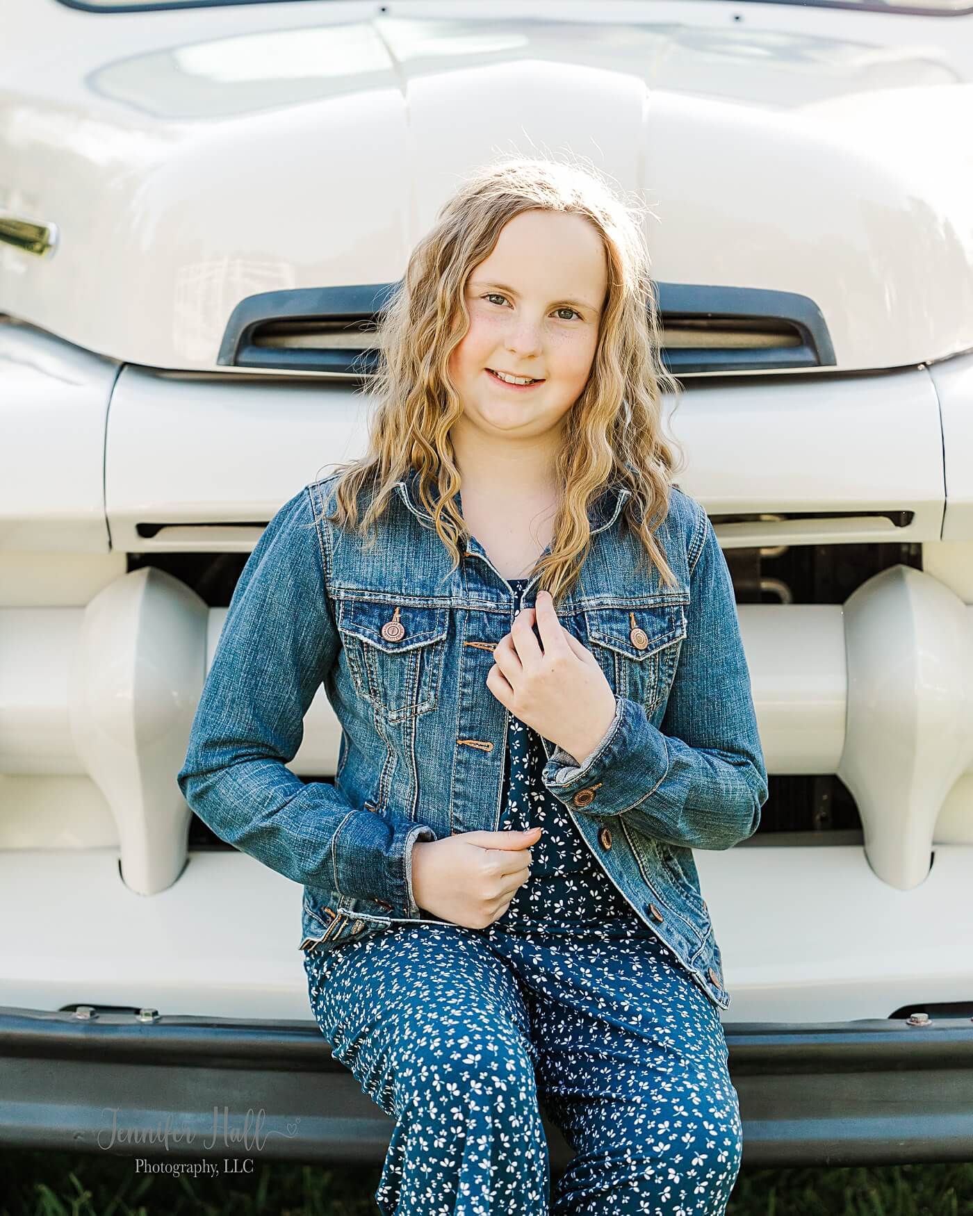 Older girl with a jean jacket showing a family picture outfit idea for an older girl.