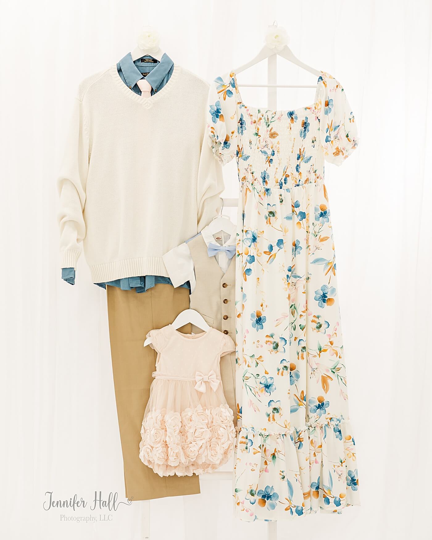 White, tan, and blue dresses and shirts to show a family picture outfit coordination example.