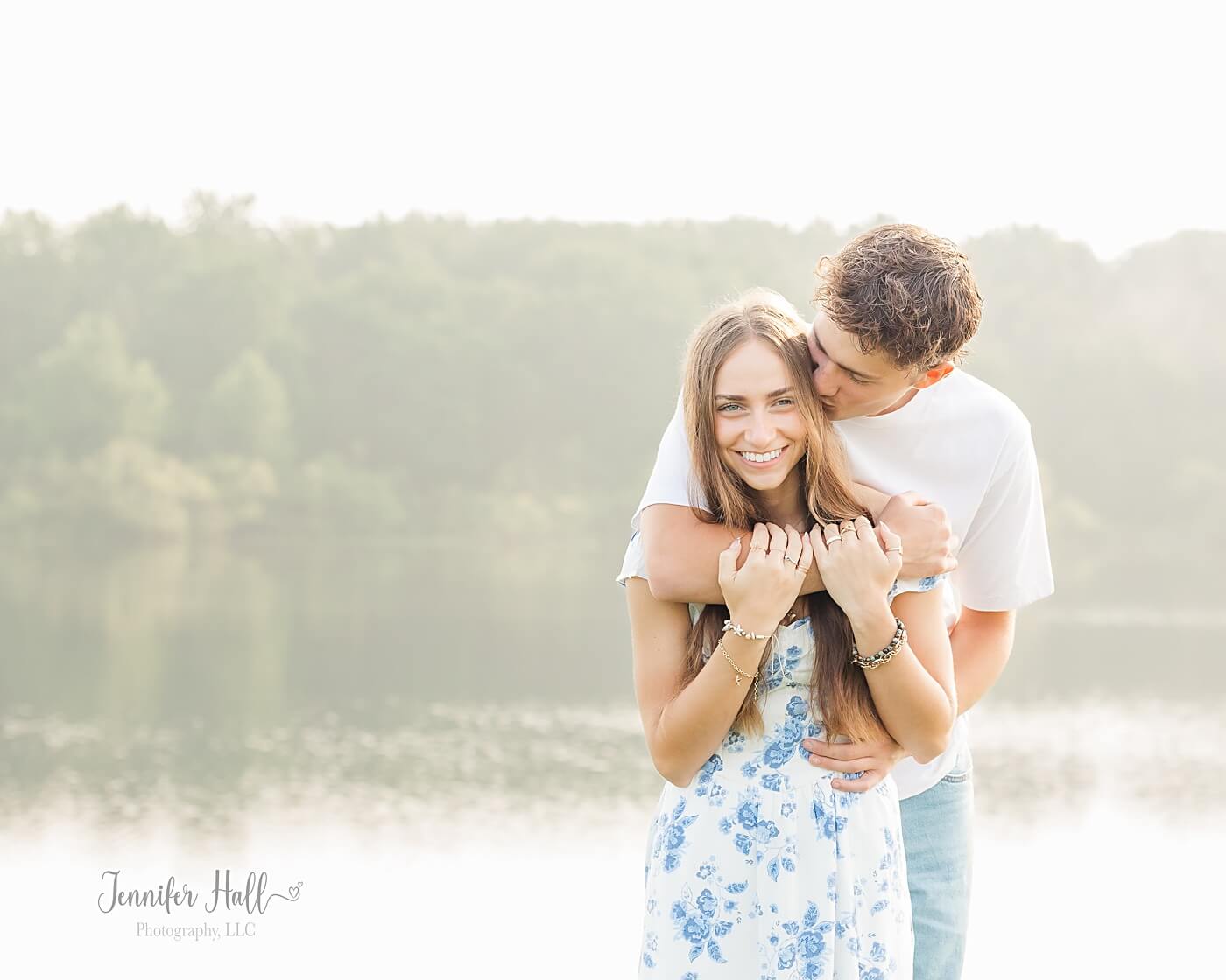 Boy kissing a girl’s cheek and the girl smiling at Howard Eaton Reservoir.