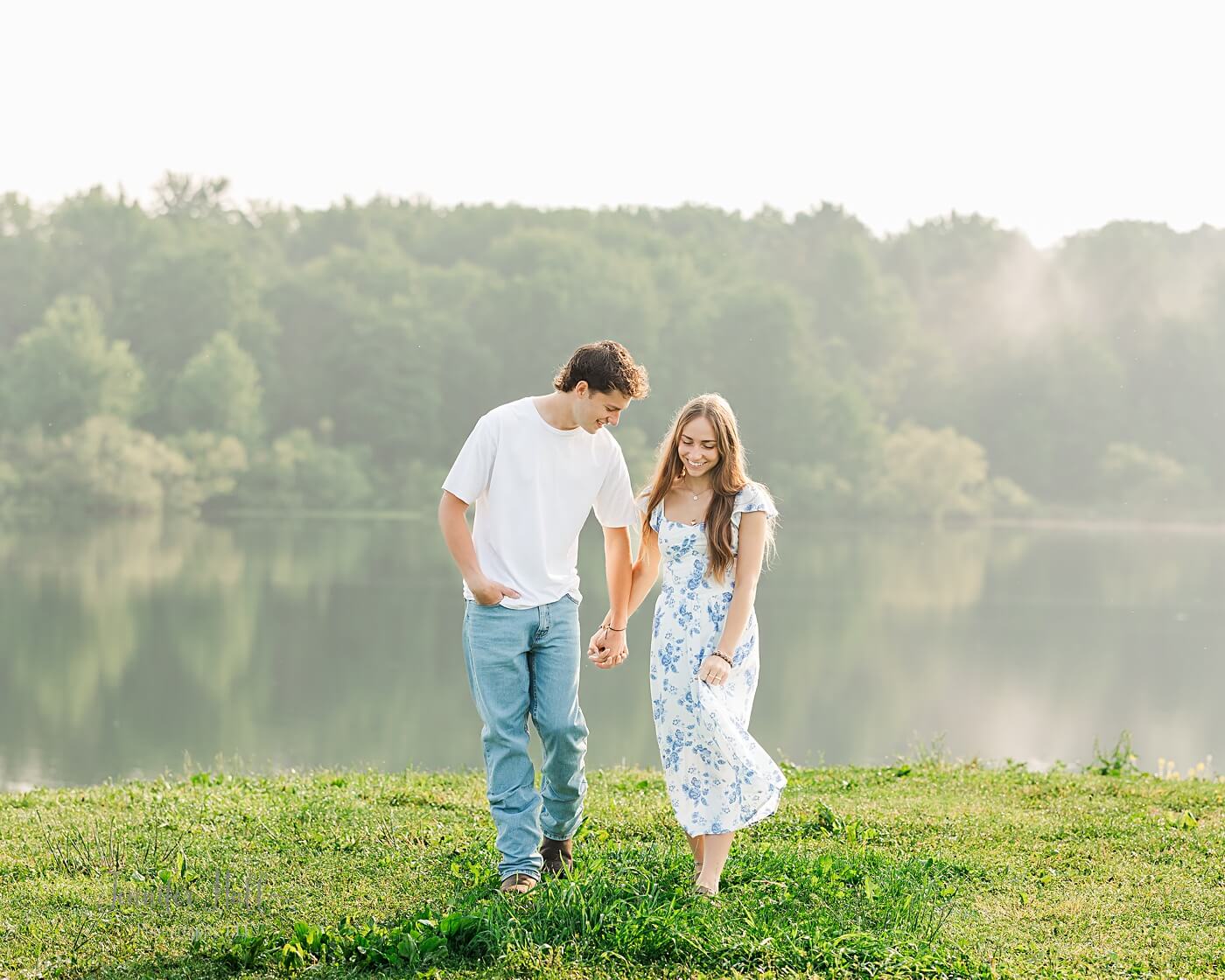 Couple walking and holding hands for Howard Eaton Reservoir in North East, PA, couple’s photos.