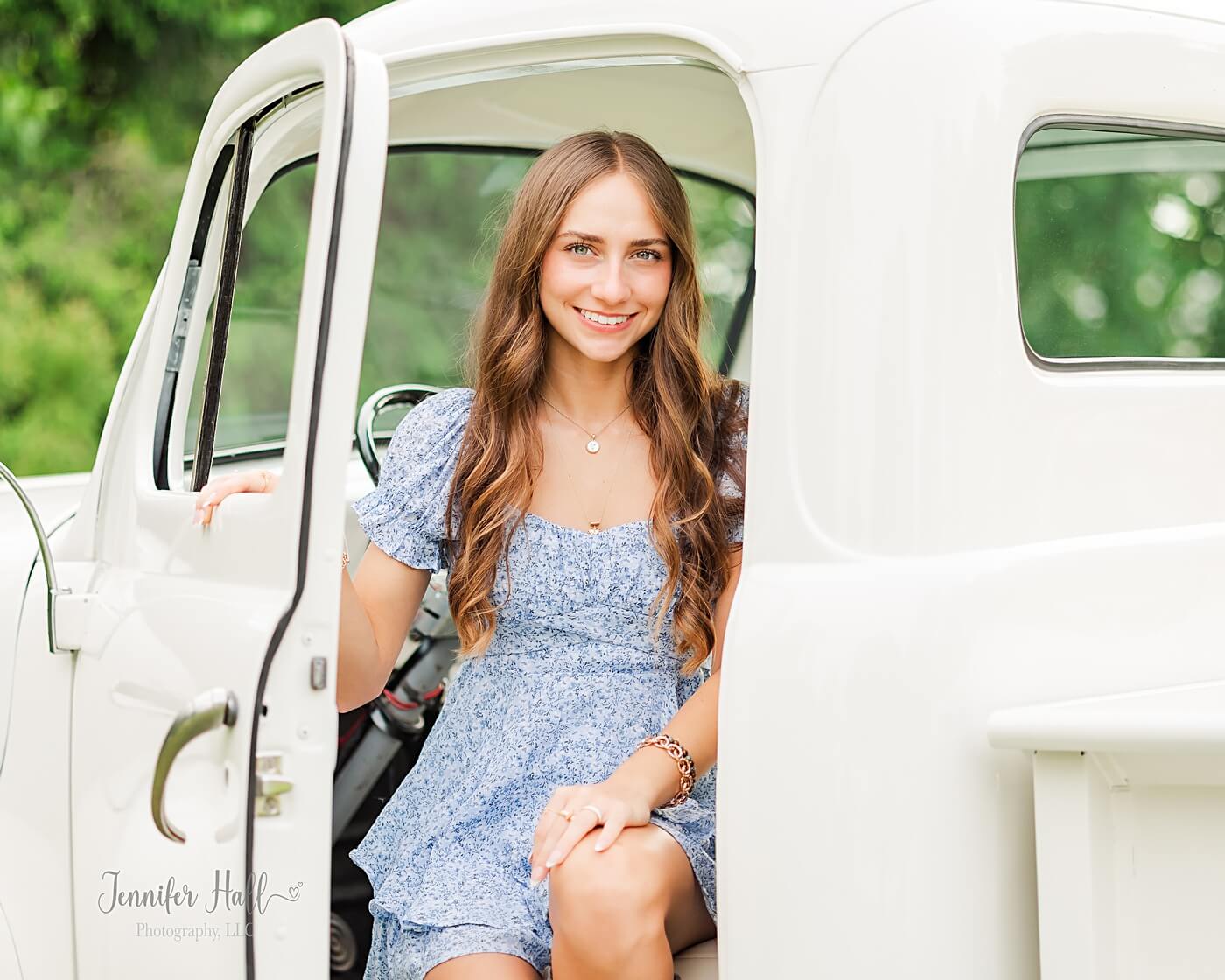 Girl sitting in the front seat of a white truck in North East, PA.